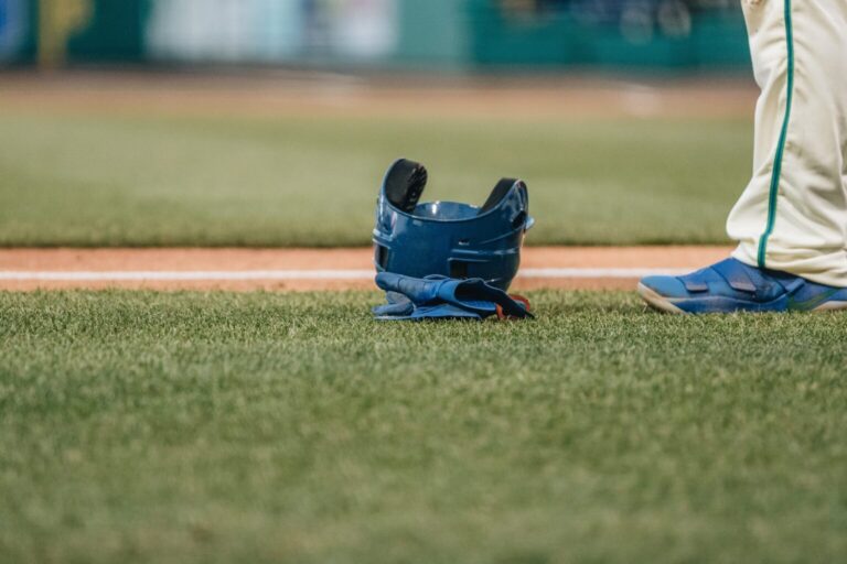 sports-and-activity-baseball-hat-on-field-with-ba-2022-11-15-05-59-03-utc