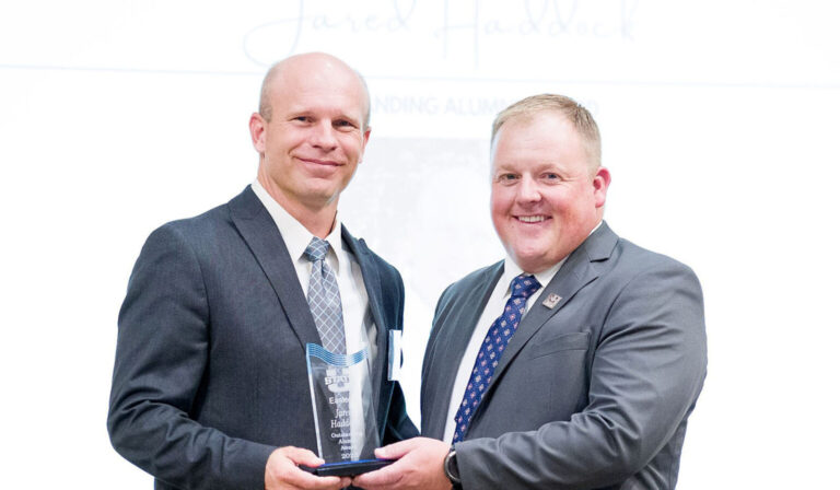 Doug-Miller-left-presents-award-to-Jared-Haddock-copy