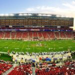 nfl stadium field full with crowd watching the game during daytime