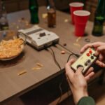 person playing with a nintendo classic family computer