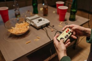 person playing with a nintendo classic family computer