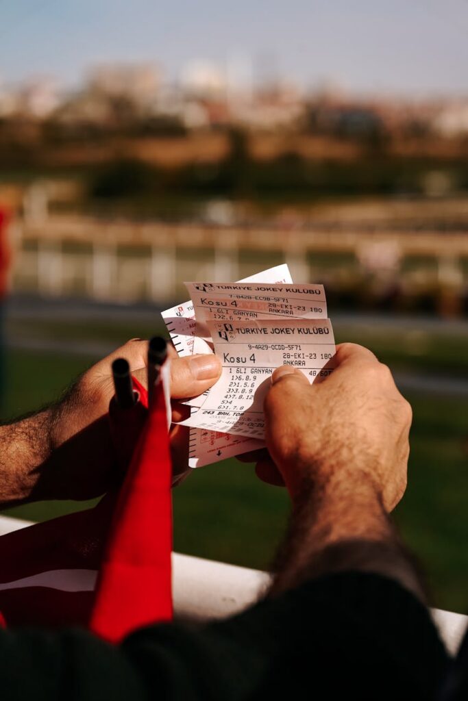 closeup of a man holding tickets on a ferry