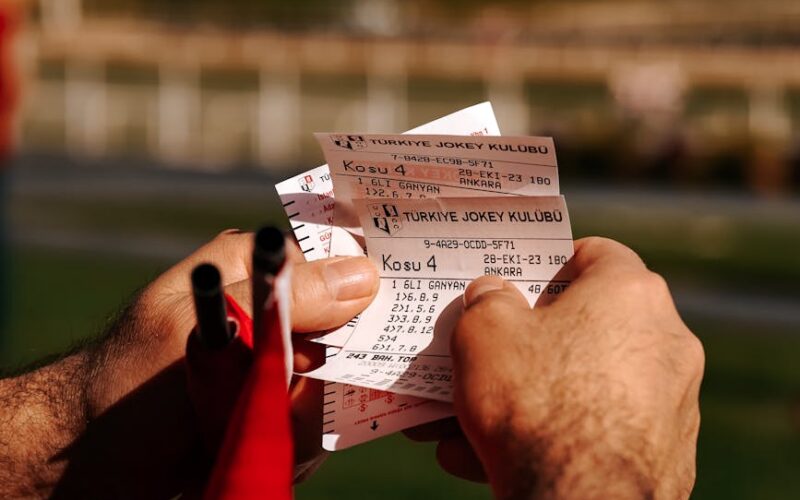closeup of a man holding tickets on a ferry
