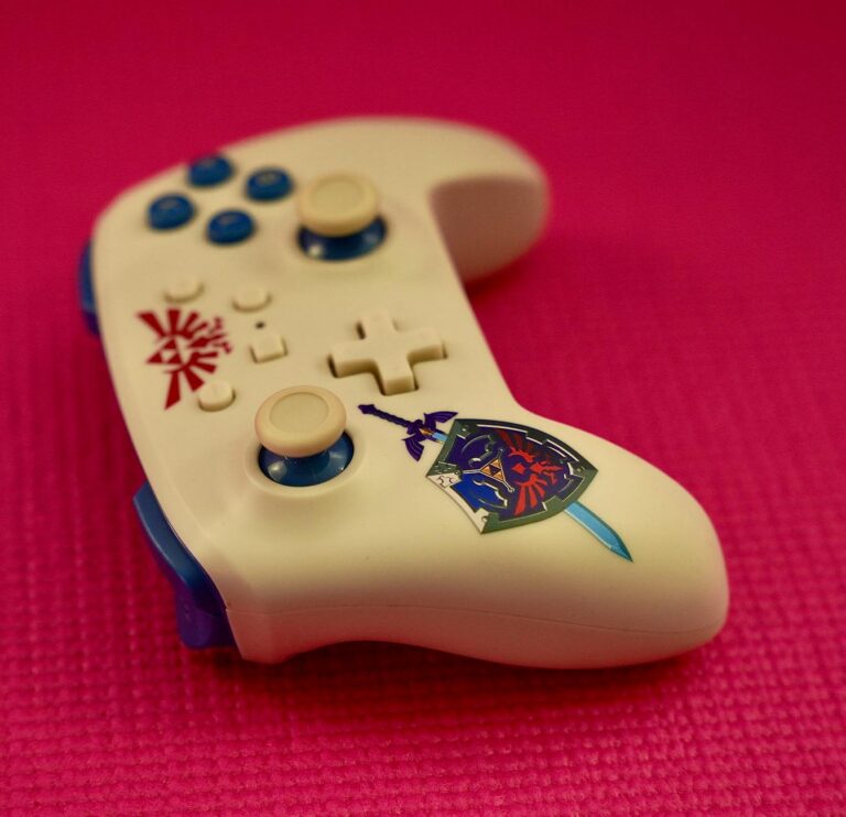 stylish gaming controller on pink background
