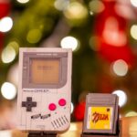 retro game boy and zelda cartridge with festive background