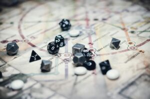 black and gray dice on white board game